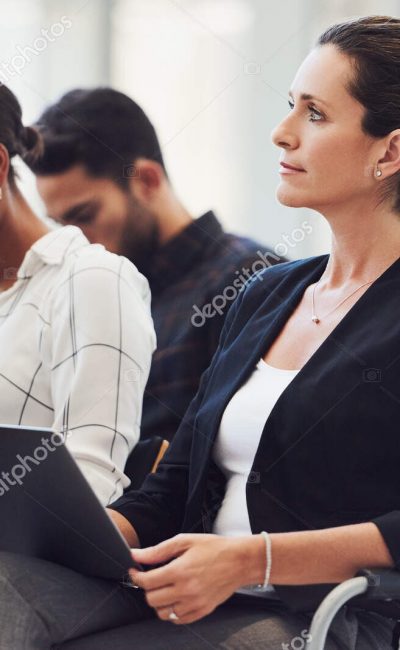 Shot of a group of businesspeople attending a conference